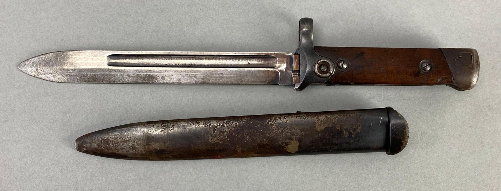 Italian Model 1938 Folding Bayonet with Scabbard: folding mechanism operational, measures 11 1/2 inches in length with a 6 1/2 inch blade