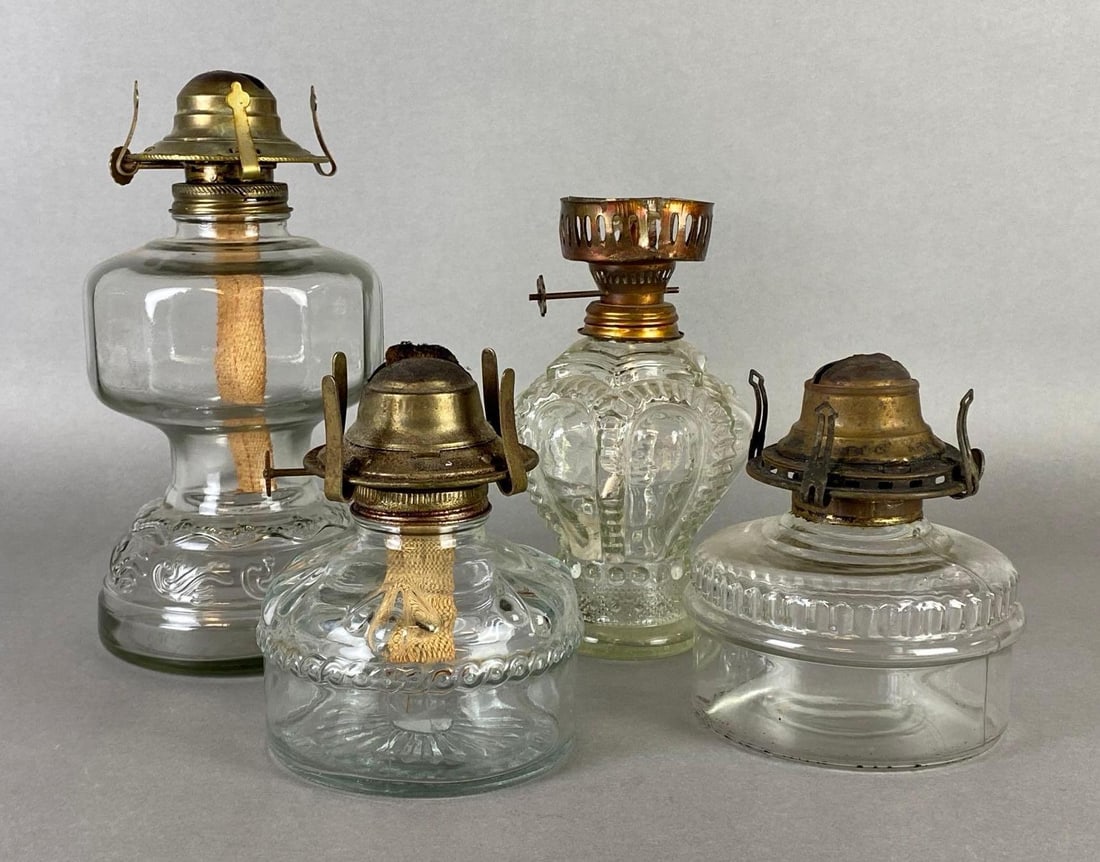 Group of 4 Clear Glass Oil Lamp Bases: Includes Eagle, and (3) unmarked, Largest measures 9 1/4 x 4 1/2 x 4 1/2 inches.