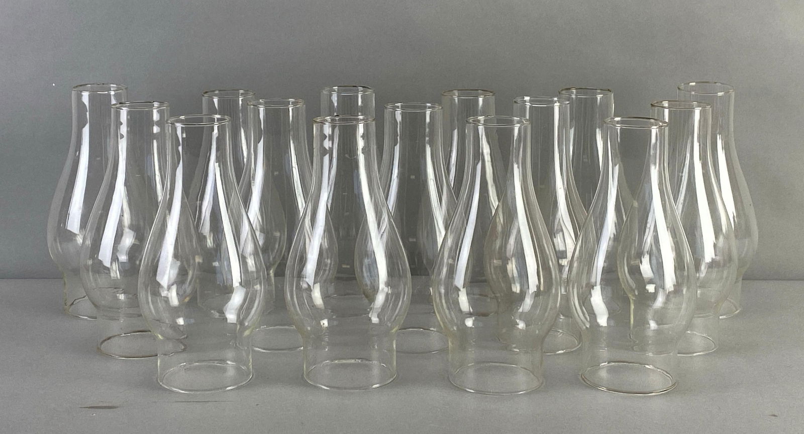 Group of Assorted Glass Oil Lamp Chimeys: Assorted sizes, largest measures 8 1/2 x 3 1/2 x 3 1/2 inches with a 2 1/2 inch fitting