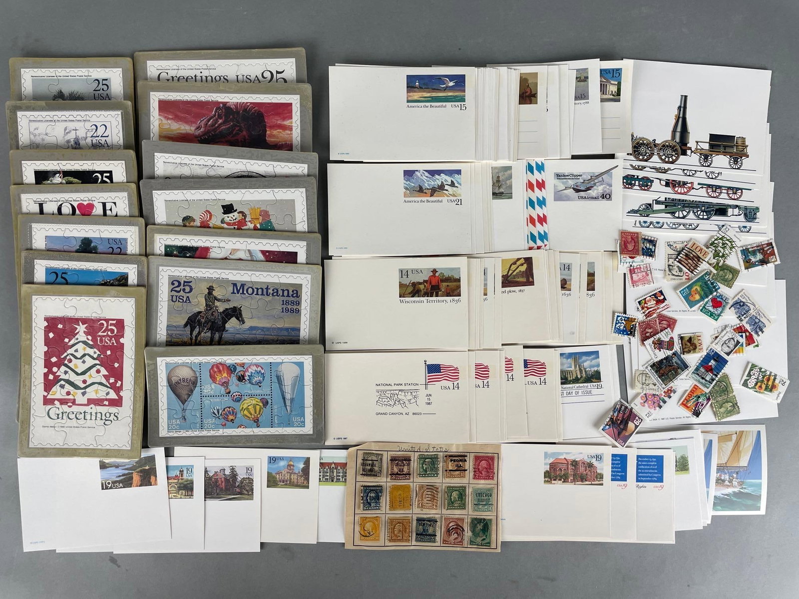 Group of USPS First Day Issues and More: Includes used stamps, stamp puzzles