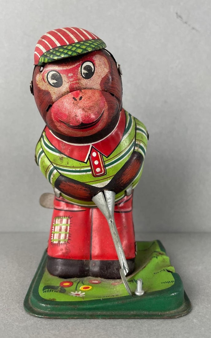 Vintage TPS Japan Wind-Up Tin Litho Golfing Monkey: Working condition. Seems to be missing part of it on the side. Measures 4 1/2 inches tall