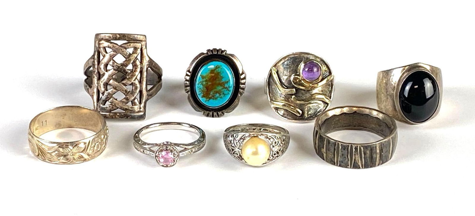 Group of 8 Sterling Silver Rings: Sizes range from 6 1/2 - 11 3/4, Includes turquoise, pink CZ, onyx, and more.
