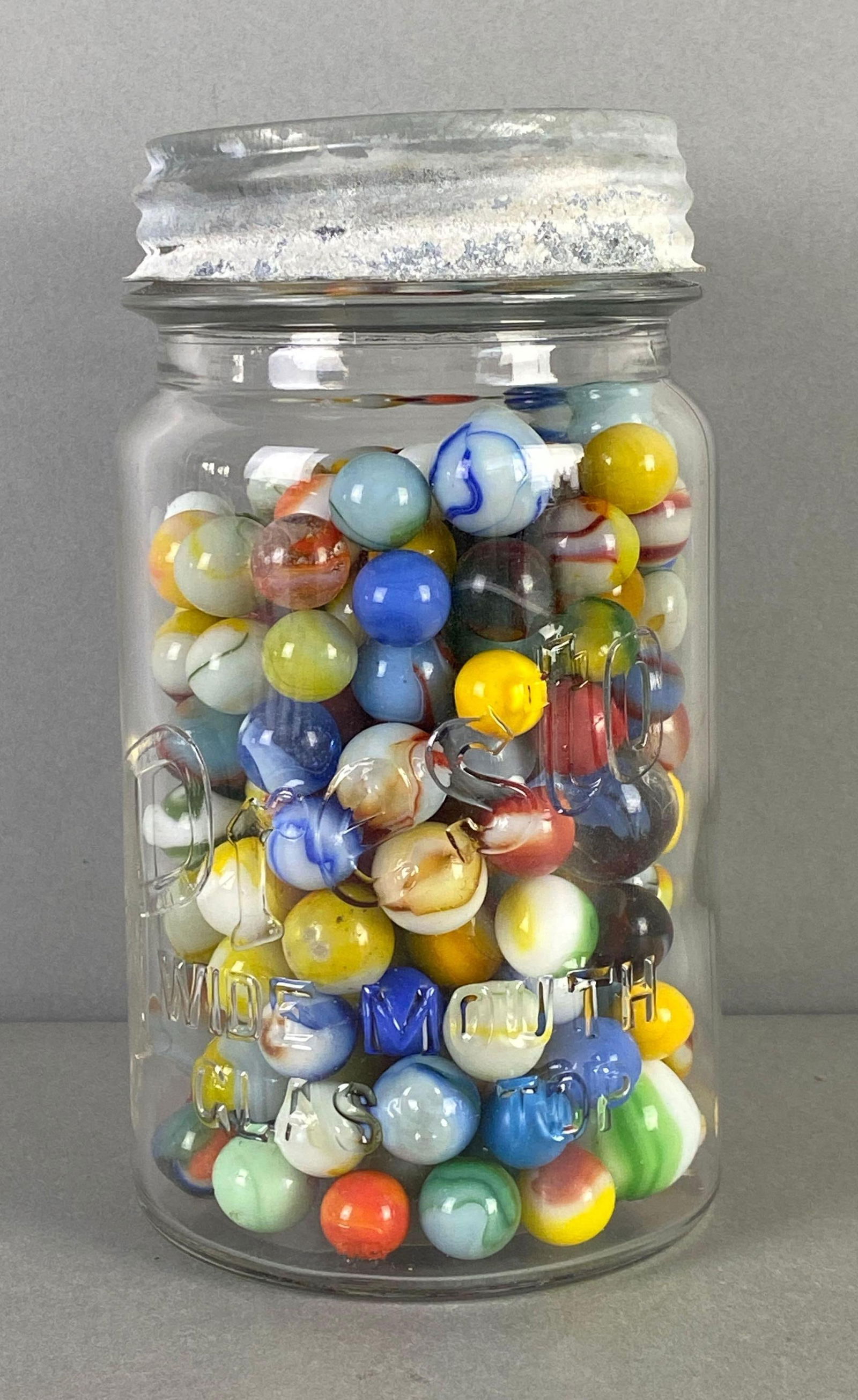 Large Group of Glass Marbles in Jar (1 of 2)