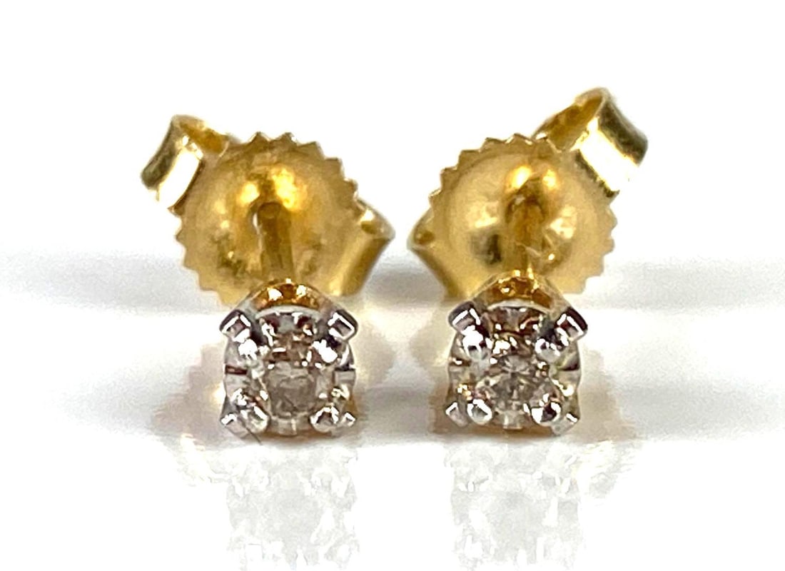 Pair of Small 14K Gold Diamond Stud Earrings: Total weight 0.5g, Both measure 1/8 inch long.