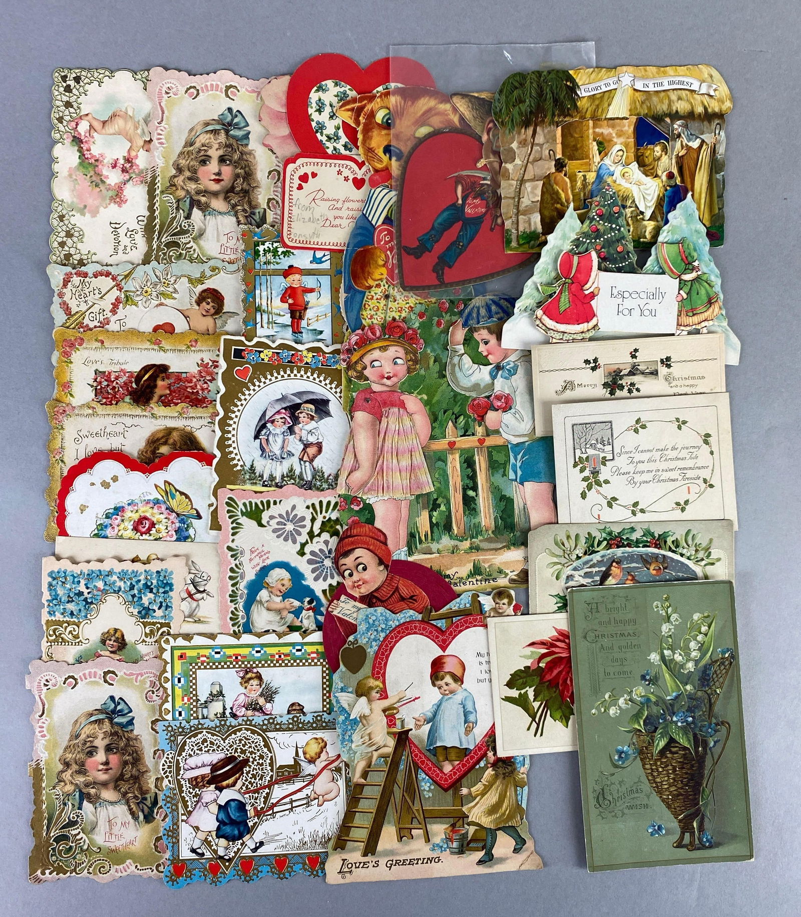 Group of Vintage Die-Cut Valentines: features people, flowers, religion and more, largest measures 5 x 3 1/2 inches