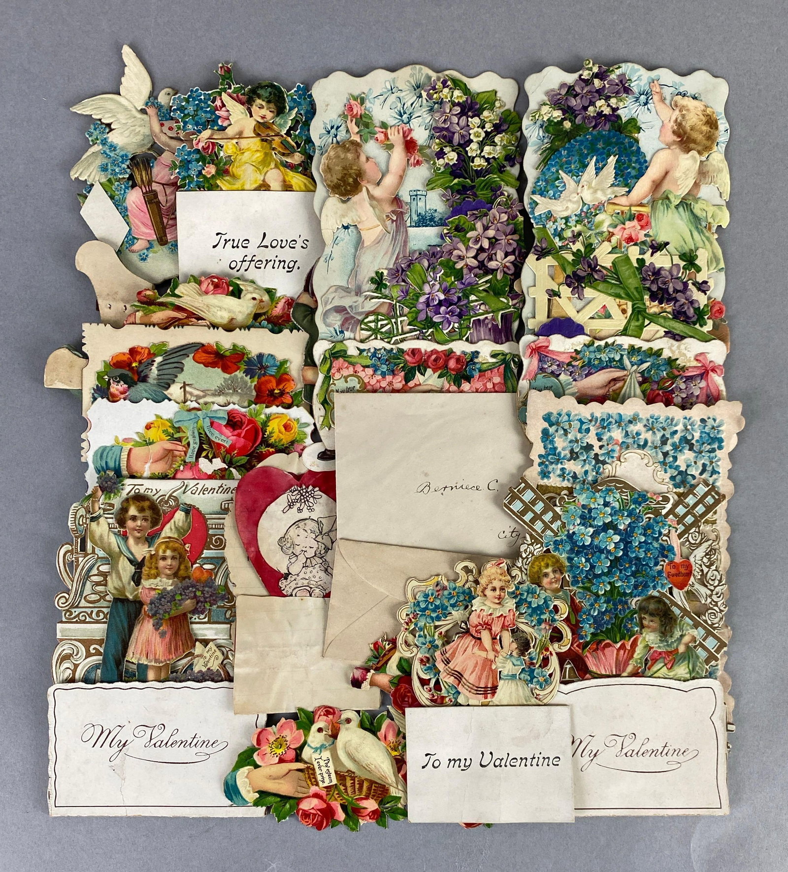 Group of Vintage Die-Cut Valentines: features flowers, angels, animals and more, largest measures 6 x 4 inches