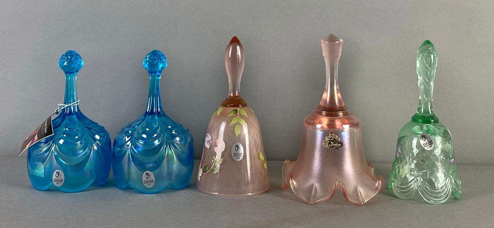 Group of 5 Fenton Art Glass Bells: in original boxes, includes 2 hand painted bells with Artist signatures, moisture damage present on boxes, largest measures 7 x 4 1/4 x 4 1/4 inches
