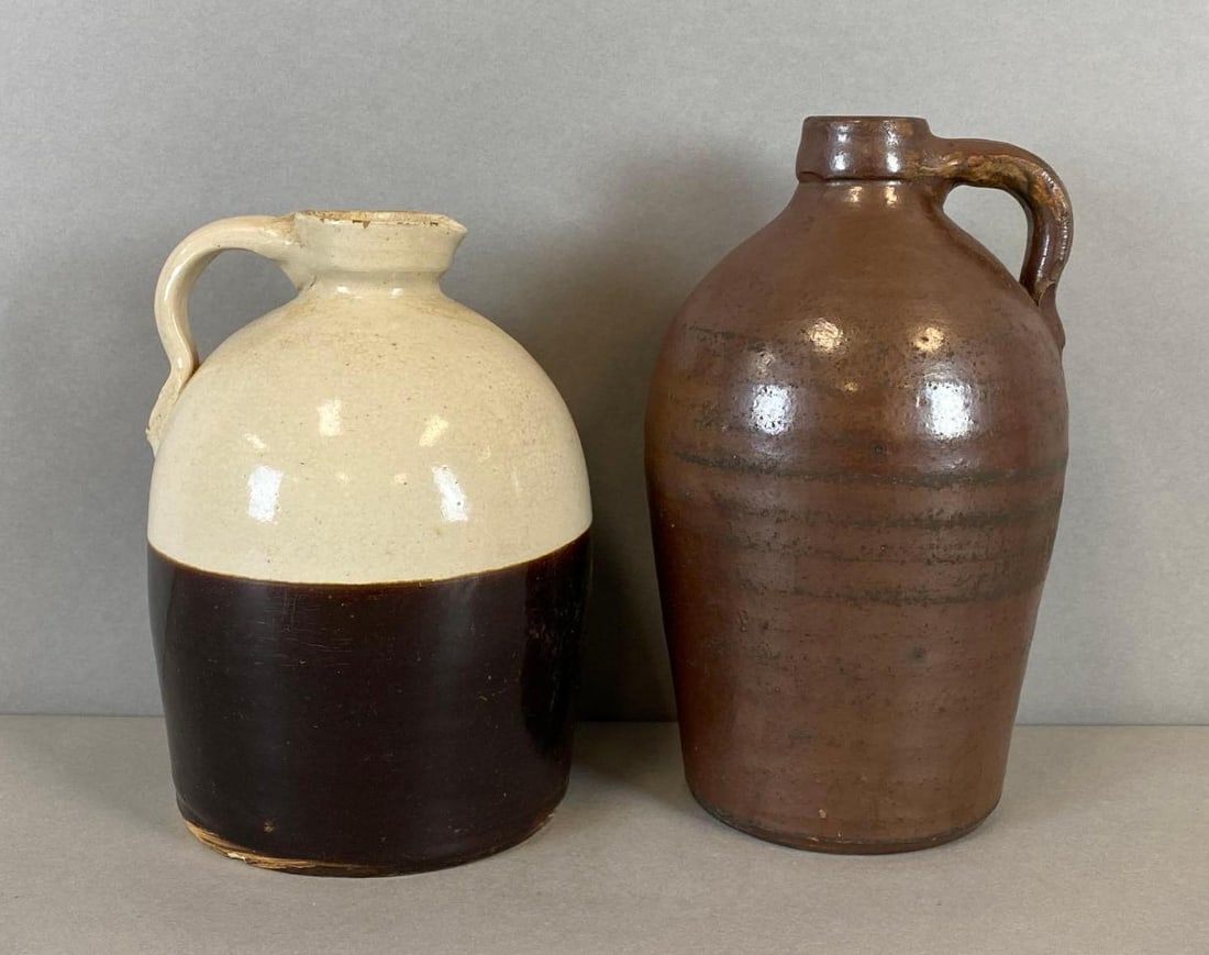 Group of 2 Antique Stoneware Jugs: Some chips. Largest measures 10 x 5 x 5 inches.