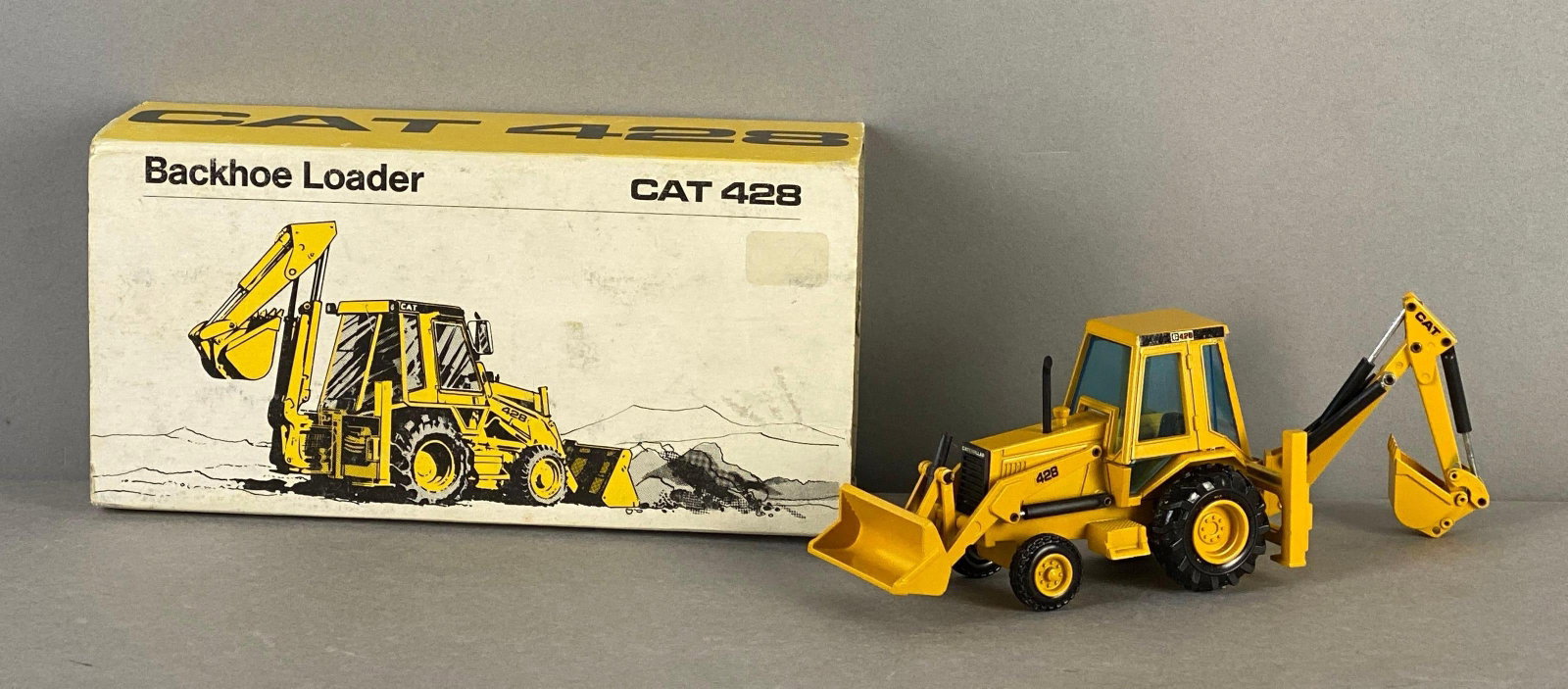 Cat 428 Die-Cast Backhoe Loader: 1 / 50 scale, made in west Germany, like new in original box