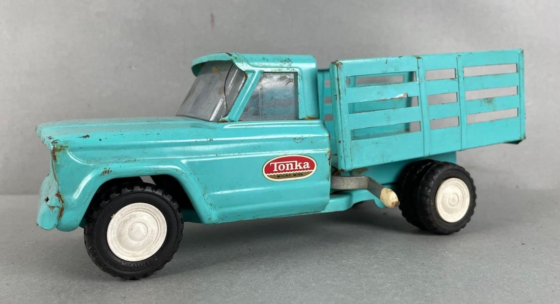 Tonka #56 Pressed Steel Stake Truck: Bent frame, cracked windshield, measures 3 3/4 x 9 1/2 x 4 inches