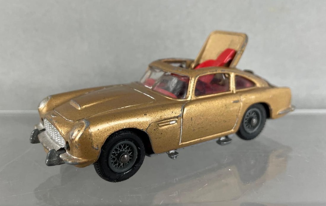 Corgi Toys James Bond Aston Martin Die-Cast Car: Ejector roof stuck open, cracked windshield, damaged rear wheel