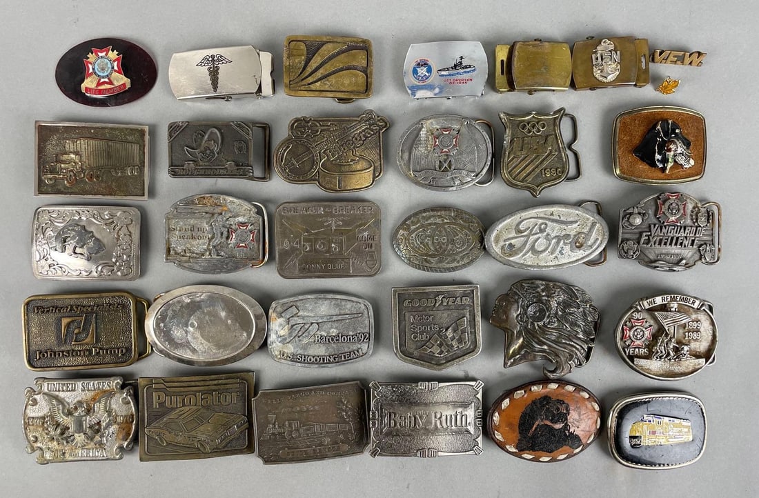 Group of Metal Belt Buckles: Includes USN, Goodyear motor sports club, Native American head, and more. Largest measures 3 x 3 1/4 inches
