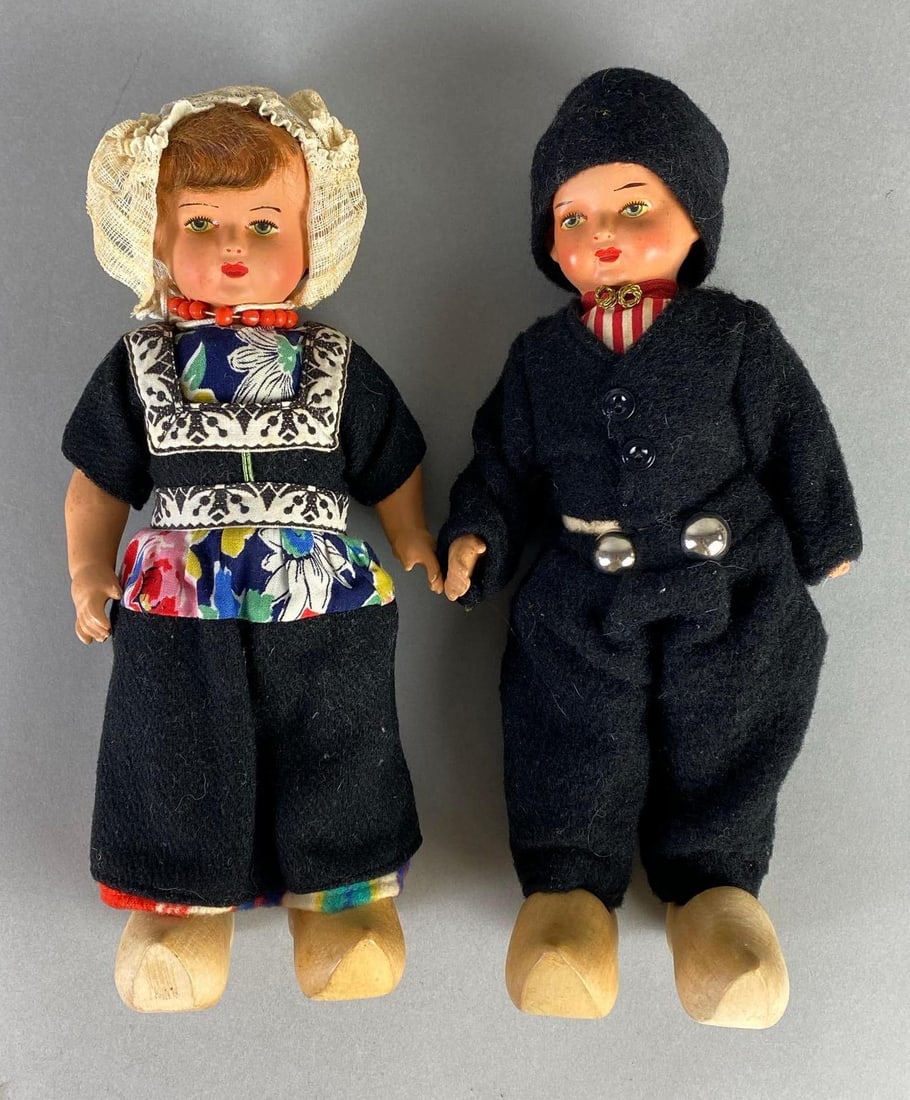 Pair of Porcelain Dutch Boy and Girl Dolls: Both 10 inches tall, Original clothes, wood shoes.