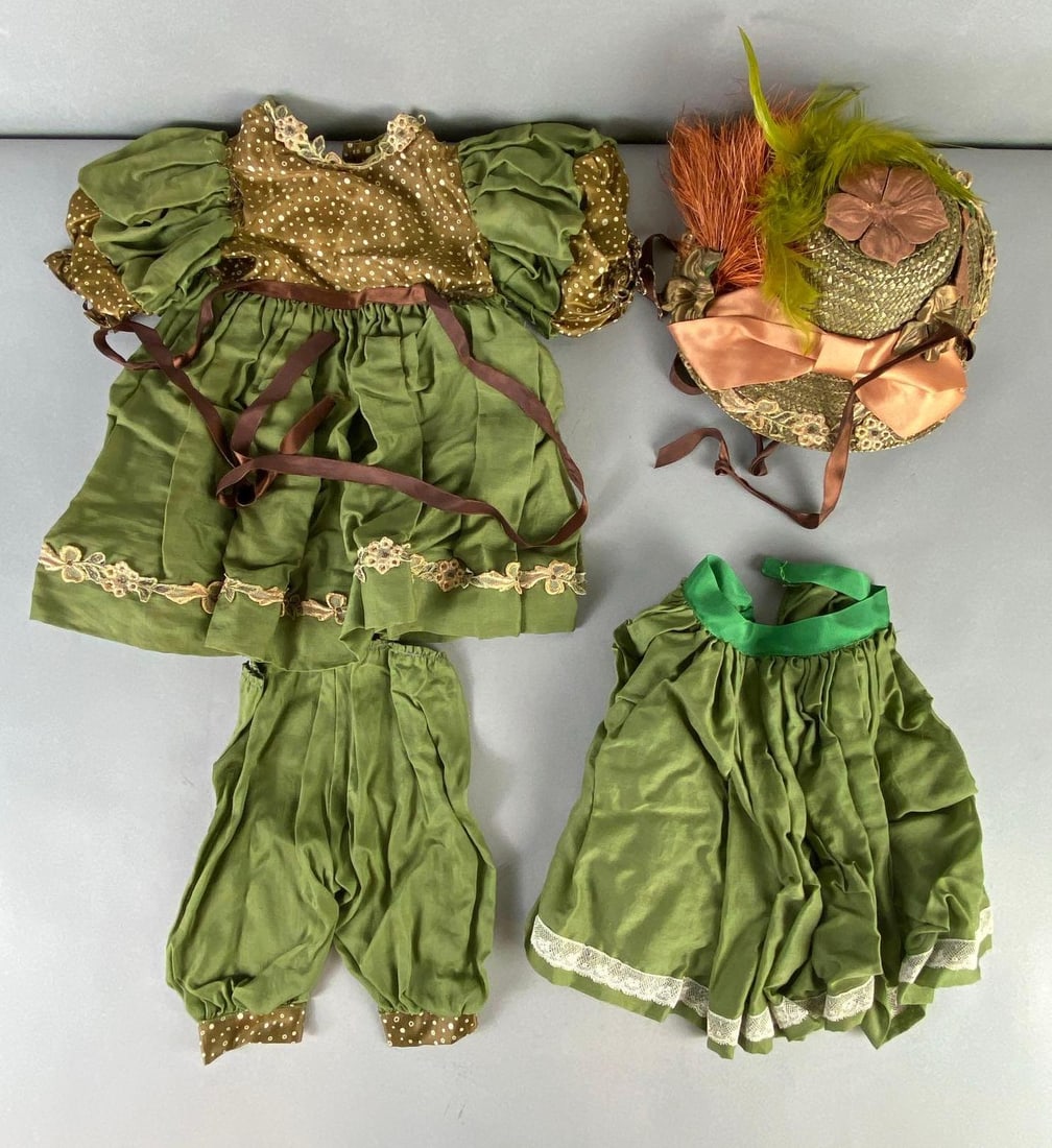 4-Piece Green Spotted Dolls Outfit: Unknown maker, Includes Drew’s, overskirt, pants, and bonnet, Dress shoulder to shoulder measures 7 inches, length measures 17 inches, Some tears on all.