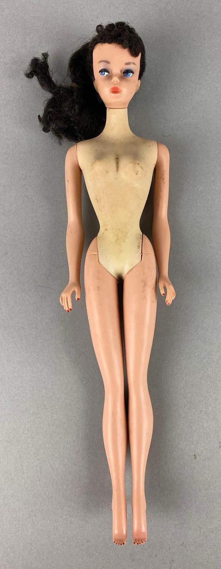 Vintage Mattel Ponytail Barbie Fashion Doll: Barbie is Brunette. Ears are green. Torso and arms are different color. Measures 11 inches.