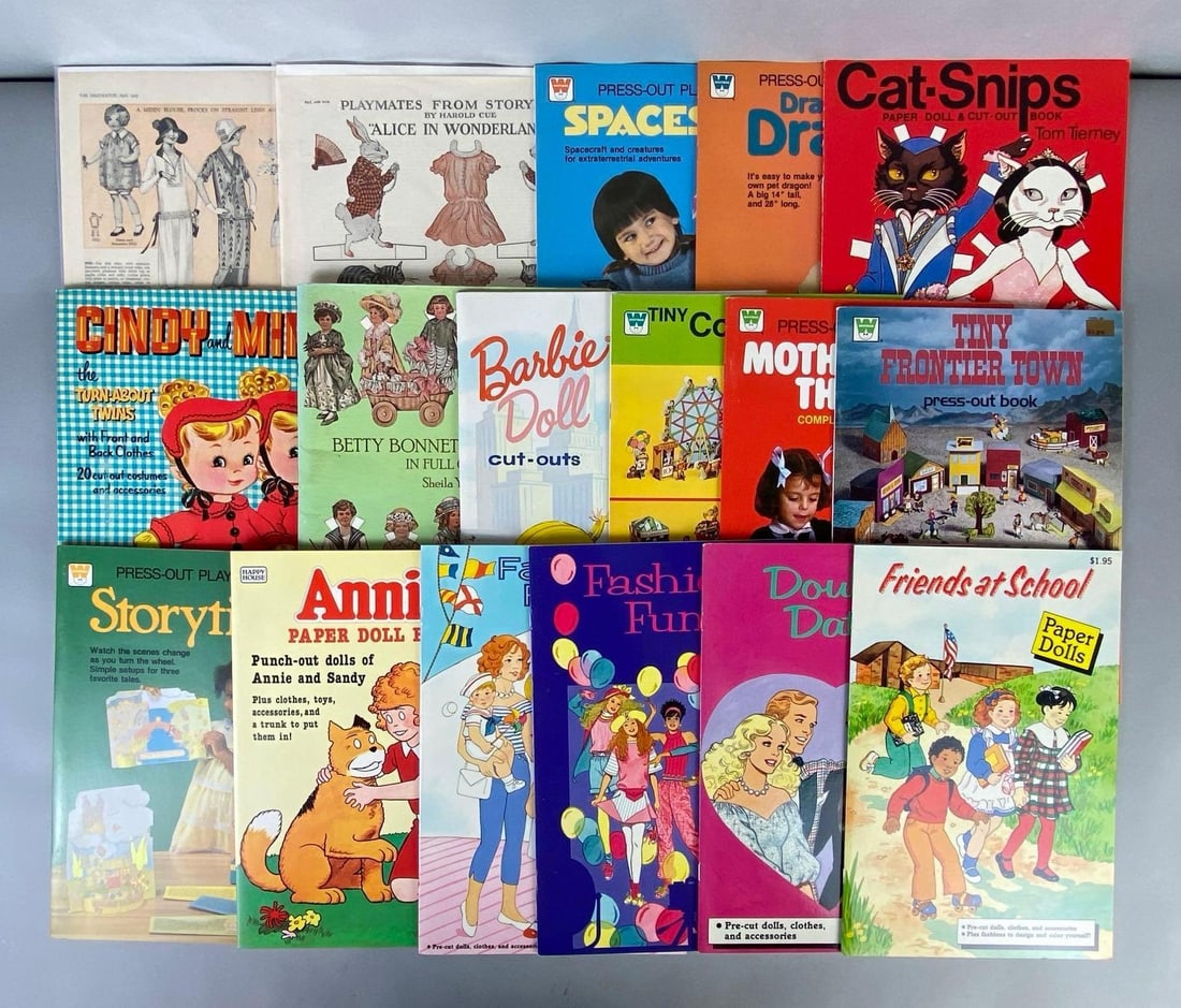 Group of Paper Dolls and More: Includes Annie, Cat-Snips, Spaceships, Tiny Frontier Town, Barbie, and more, Unknown set completions, Largest measures 14 1/4 x 11 inches.