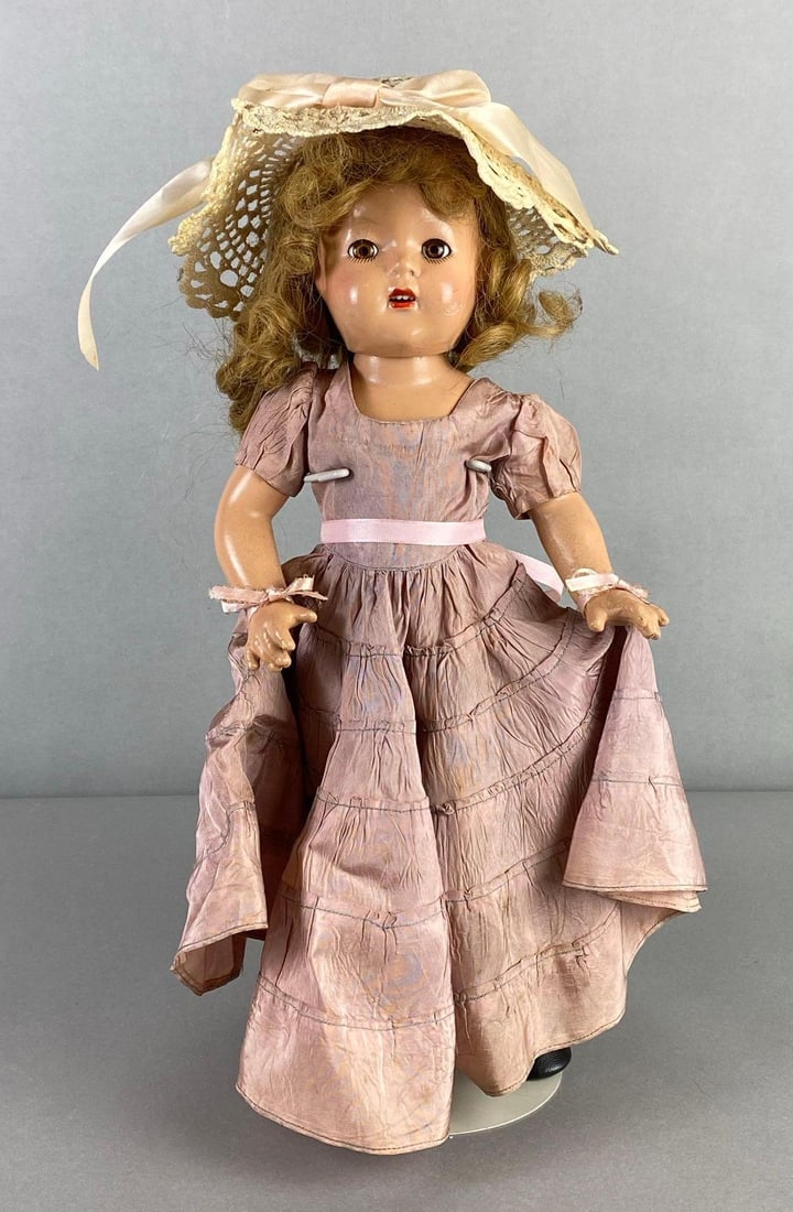 Alexander Doll Co. Princess Elizabeth Composition Doll: Blonde hair, Brown sleep eyes, Open mouth, 4 teeth, Some cracks, Large cracks on face and back, Measures 16 1/2 inches tall, Doll stand not included.