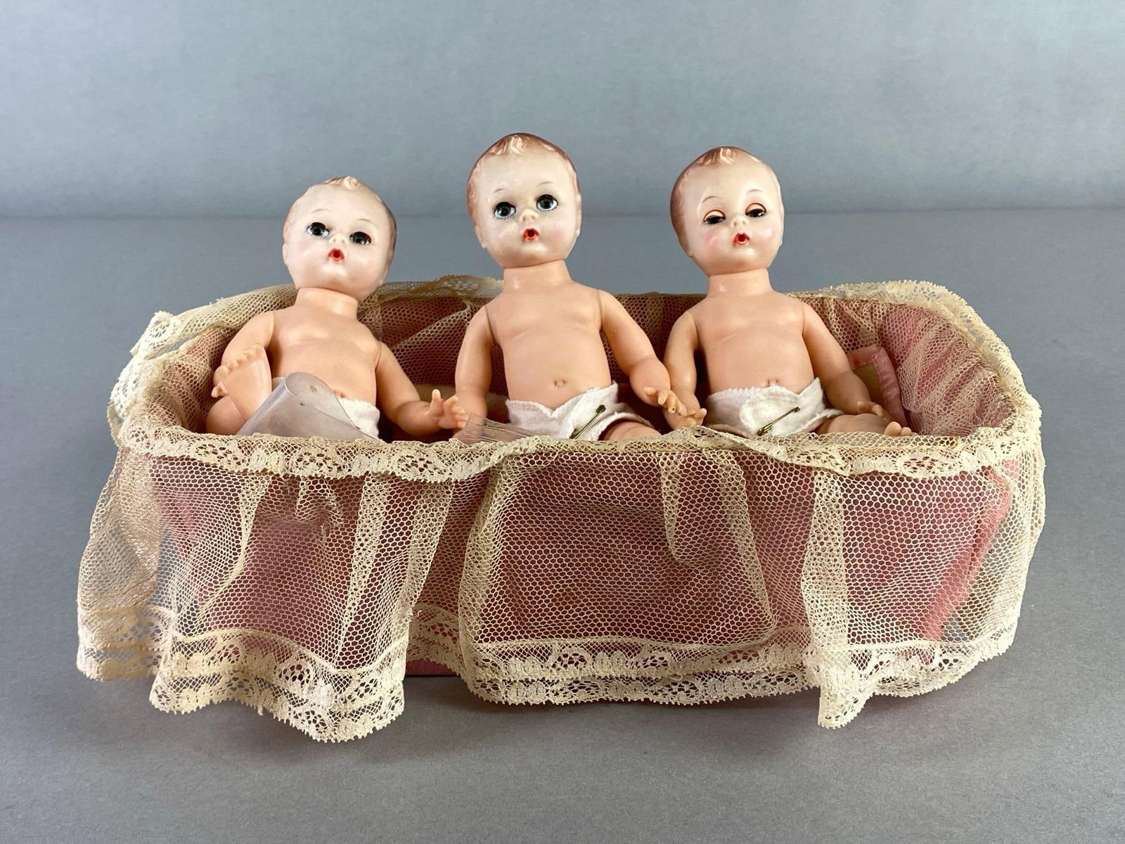 Group of 3 Fisher Price Quints Vinyl Baby Dolls in Bassinet: All measure 7 inches tall, Bassinet measures 3 1/4 x 10 1/4 x 6 1/2 inches.