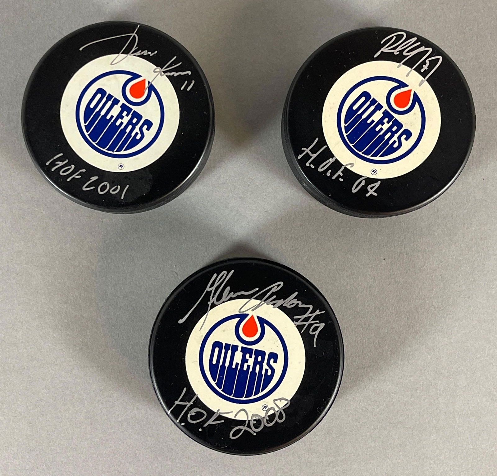 3 - Signed Official NHL Oilers Pucks with Inscriptions (1 of 3)