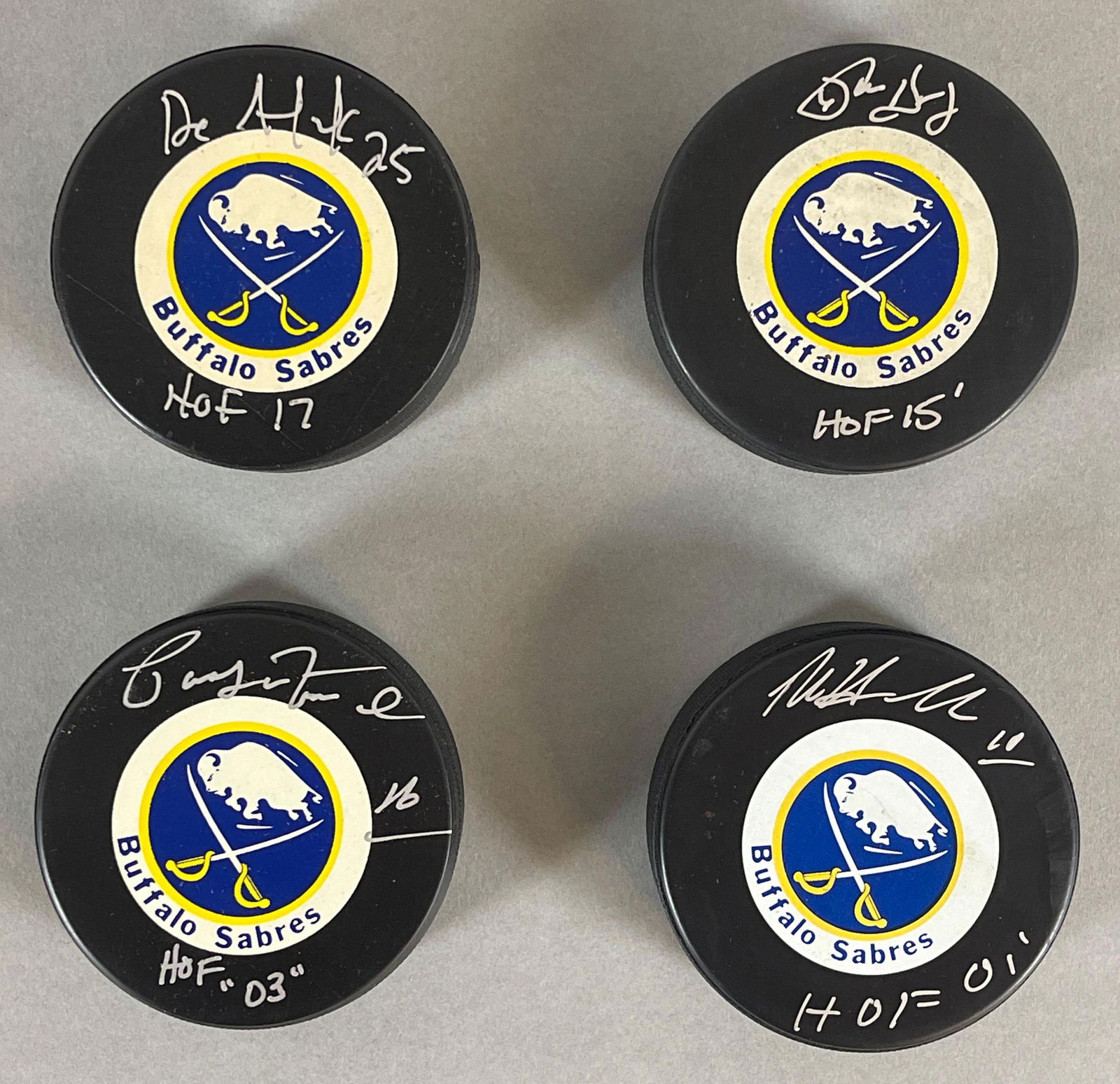 4 - Signed Official NHL Sabres Pucks with Inscriptions (1 of 3)