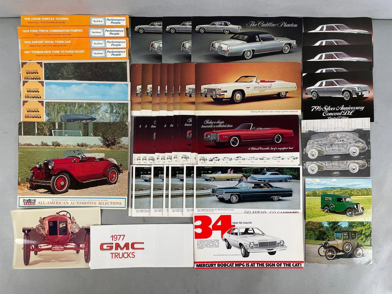 Group of Vintage Automobile Advertising Postcards: Includes antique cars, AMC concords, Cadillac, and more. Largest measures 6 x 9 inches