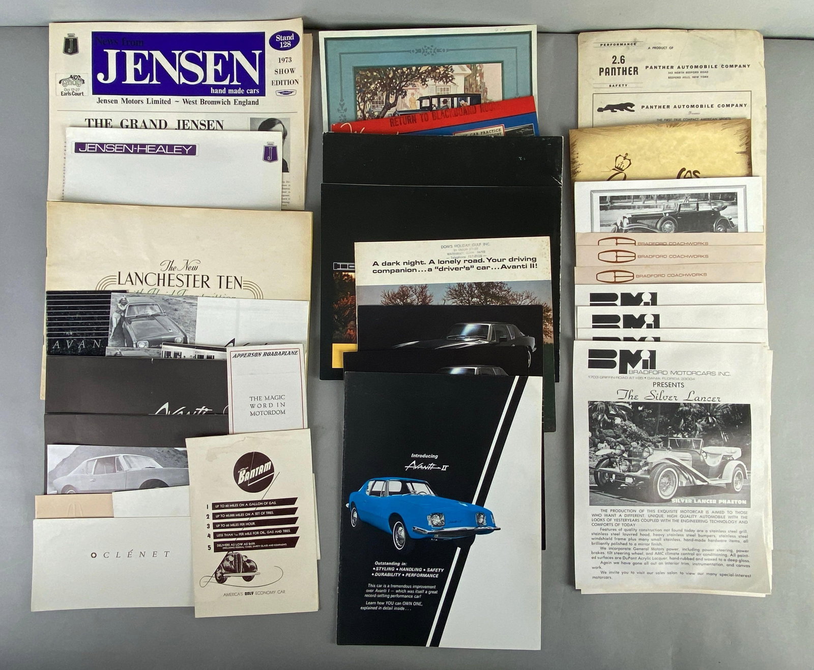 Group of Vintage Automobile Dealership Advertising Brochures: Includes 1974 Jensen, 2.6 Panther, Bradford coach works and more, largest measures 13 x 10 inches