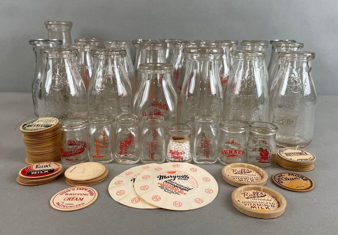 Group of Milk Advertising Half Pint Glass Bottles and Caps: Includes kleins, shady lane dairy, Londons farm, and more. Largest measures 7 x 2 1/2 inches