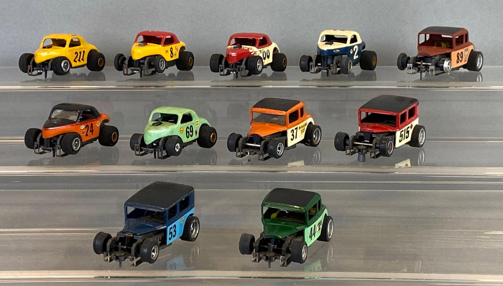 Group of 11 Vintage Hot Rod Slot Cars: Some missing rubber tires, largest measures 2 1/2 inches in length