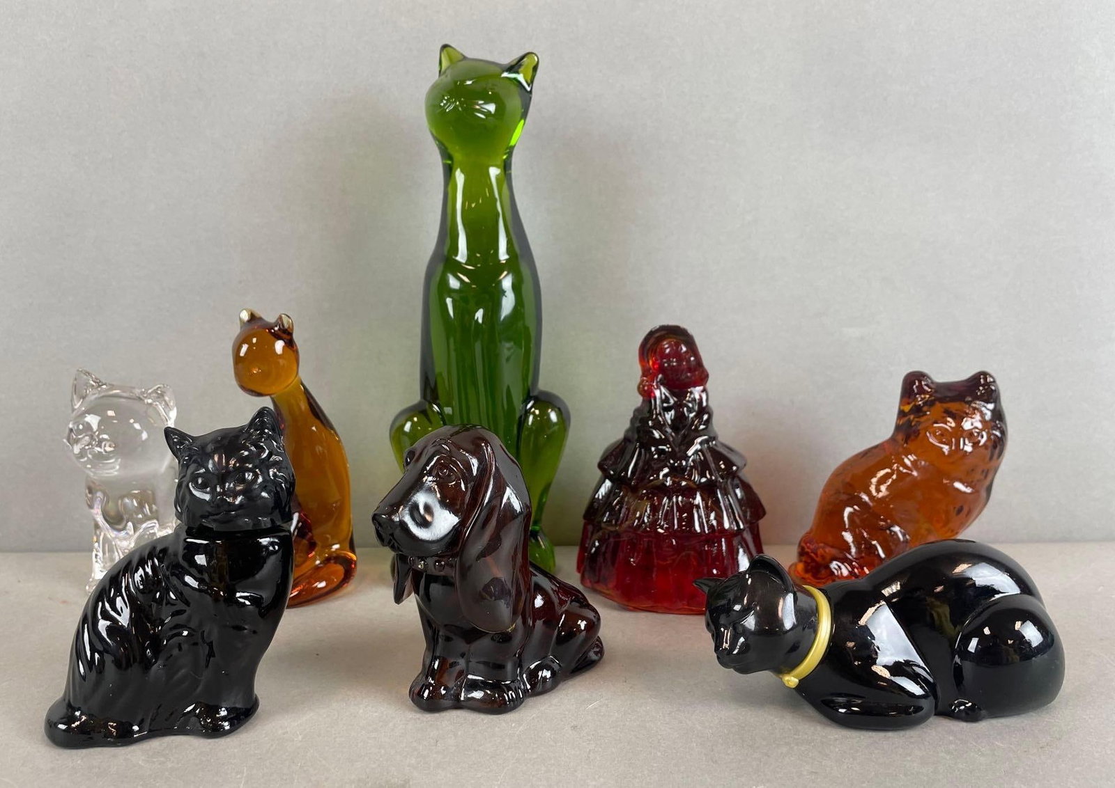 Group of Glass Cat Figurines and More: Includes Avon dog and cat perfume bottles with liquid , princess house crystal cat, Viking amber glass car, tallest measures 8 1/2 inches