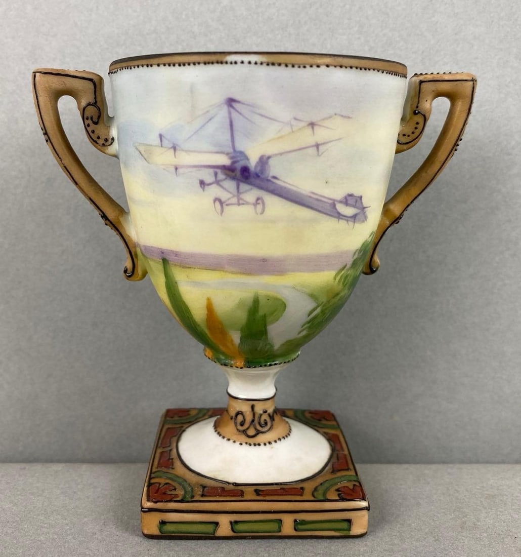 Nippon Hand Painted Porcelain Aeroplane Small Vase: Depict plane flying over a field. Measures 3 3/4 x 4 x 2 1/2 inches.
