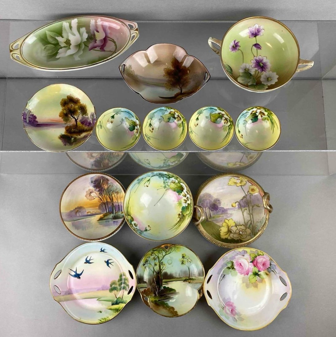 Group of 14 Hand Painted Porcelain Items: Features RS Germany, Noritake and Nippon. Includes bowl, little trinket dishes, small plate and more. Largest item measures 3 x 7 1/2 x 7 1/2 inches.