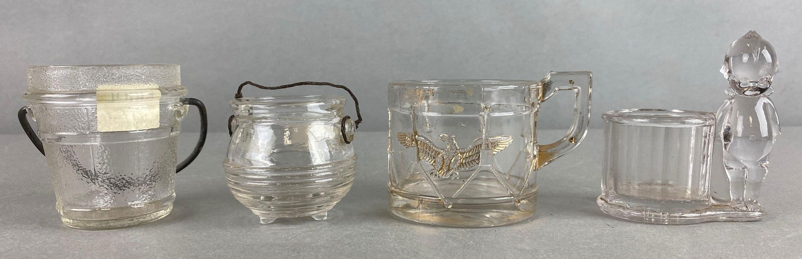 Vintage Child Drum and Eagle Mug and More: Includes ice bucket, kettle and Geo Borgfeldt Kewpie shaped Candy Containers. Kewpie is missing and arm. Largest item measures 2 1/2 x 3 x 2 1/2 inches.