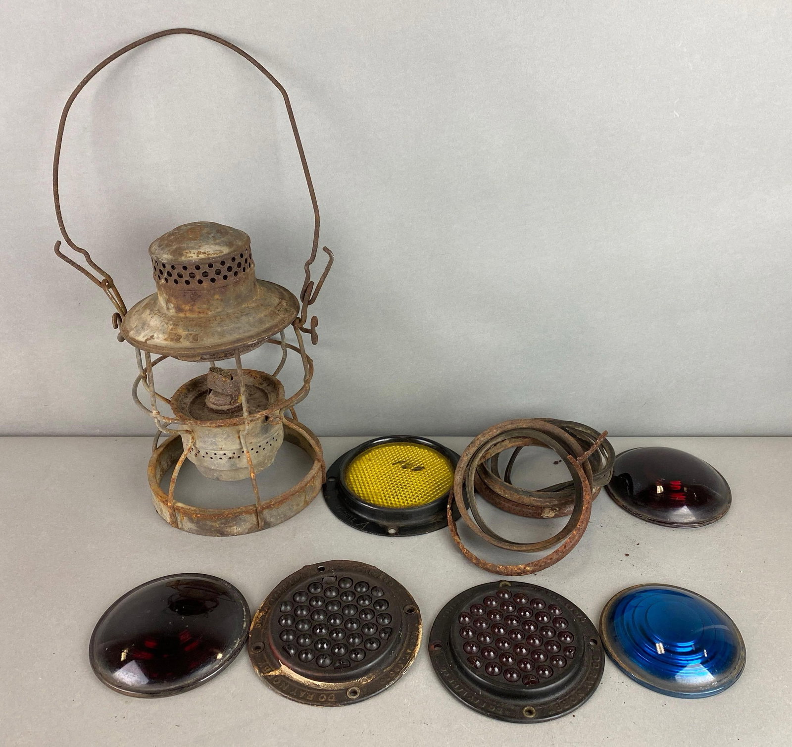 Grand Trunk Western Train Kerosene Lantern and Lenses: Has wear with age. Includes 6 lenses and 3 rims. Lantern measures 9 1/2 x 6 1/2 x 6 1/2 inches.