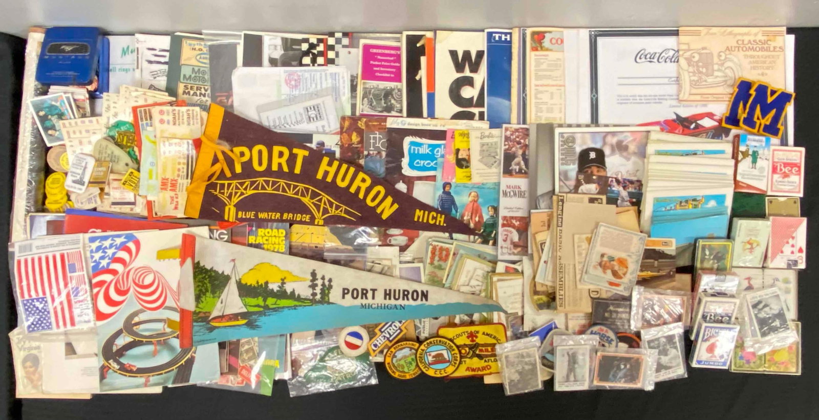 Large Group of Ephemera Items: Includes Boy Scout patches, 1976 AFX magazine, Classic automobile lithographs and more. Largest item measures 25 x 8 1/4 inches.