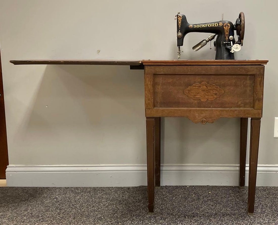 Antique Rockford Sewing Machine and Table: No in-house shipping available, 3rd party shipper recommended. Missing cord, needs refinishing. Measures 30 1/4 x 22 3/4 x 17 1/4 inches