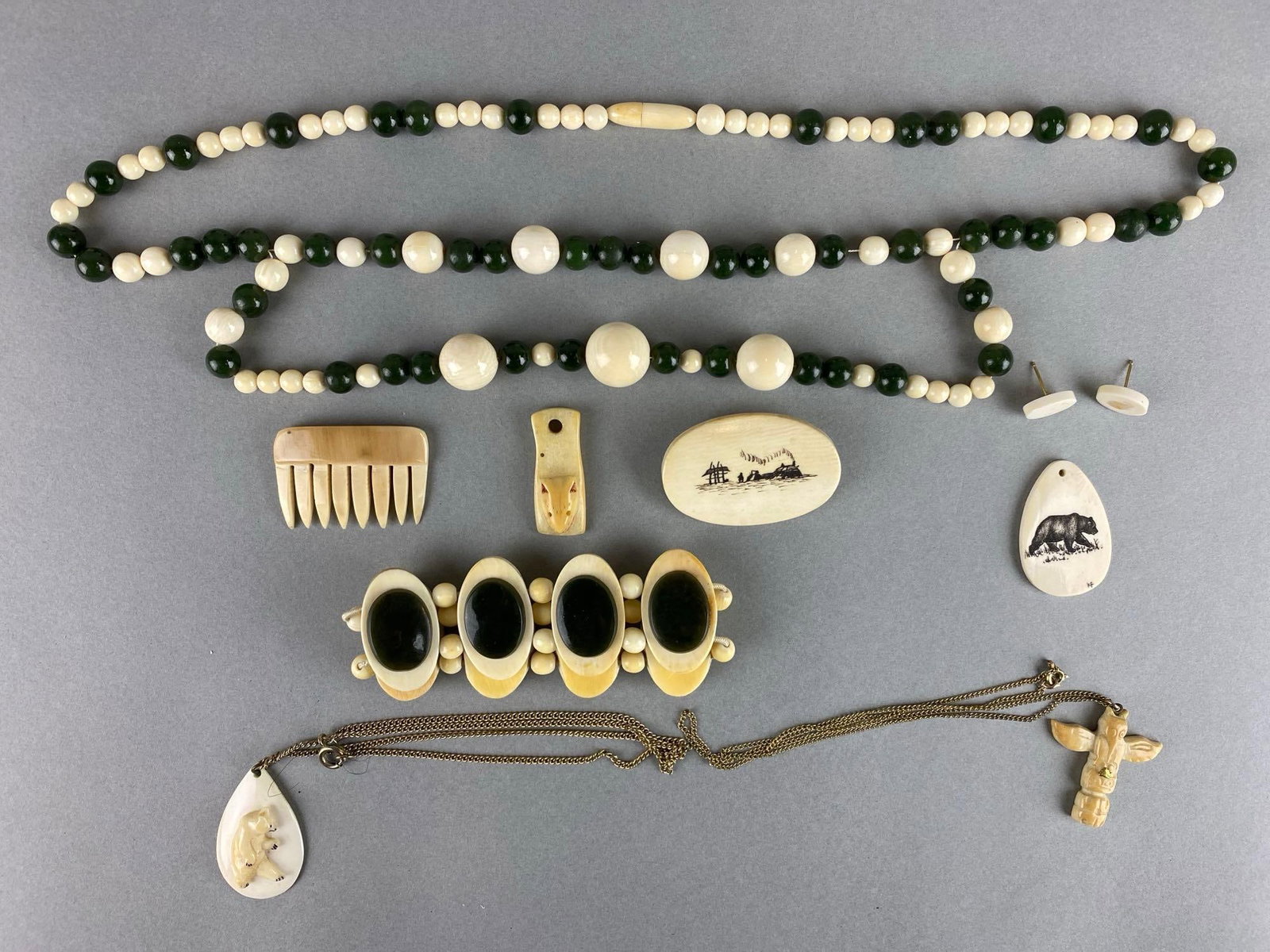 Group of Costume Jewelry Bone Necklaces and More: Includes pendant, pin, bracelet and more. Longest necklace measures 22 inches.