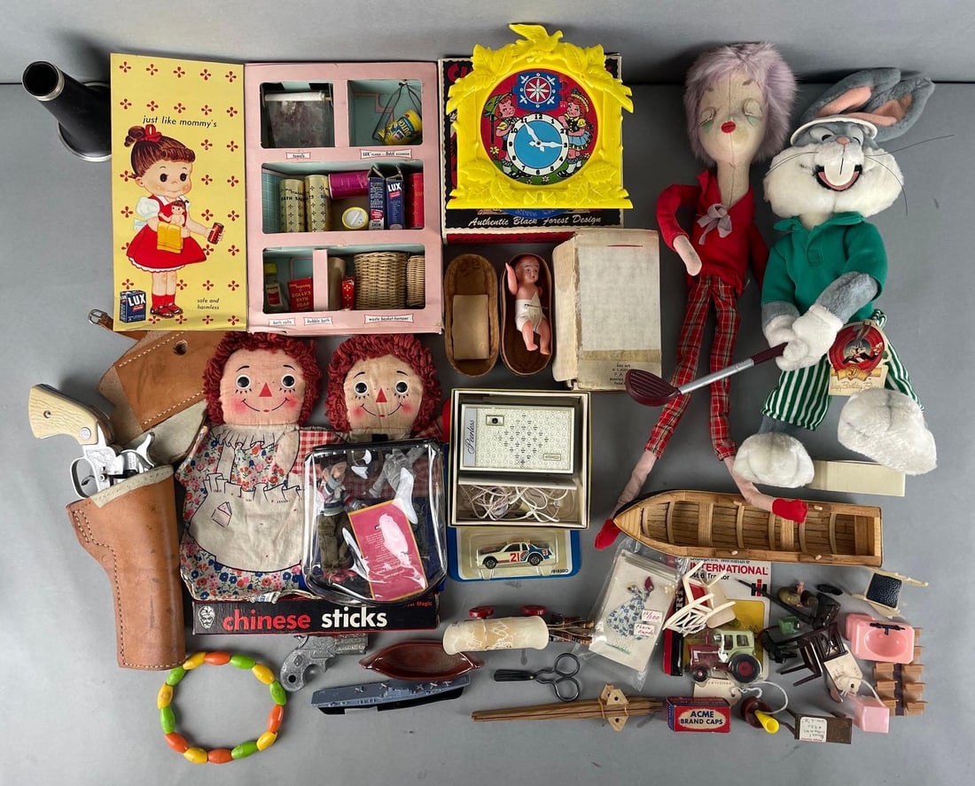 Group of Assorted Vintage Doll Toys and More: Includes raggedy Ann and Andy puppets, peerless transistor radio, cuckoo clock bank, and more. Cap guns nonworking. Bugs measures 16 inches tall