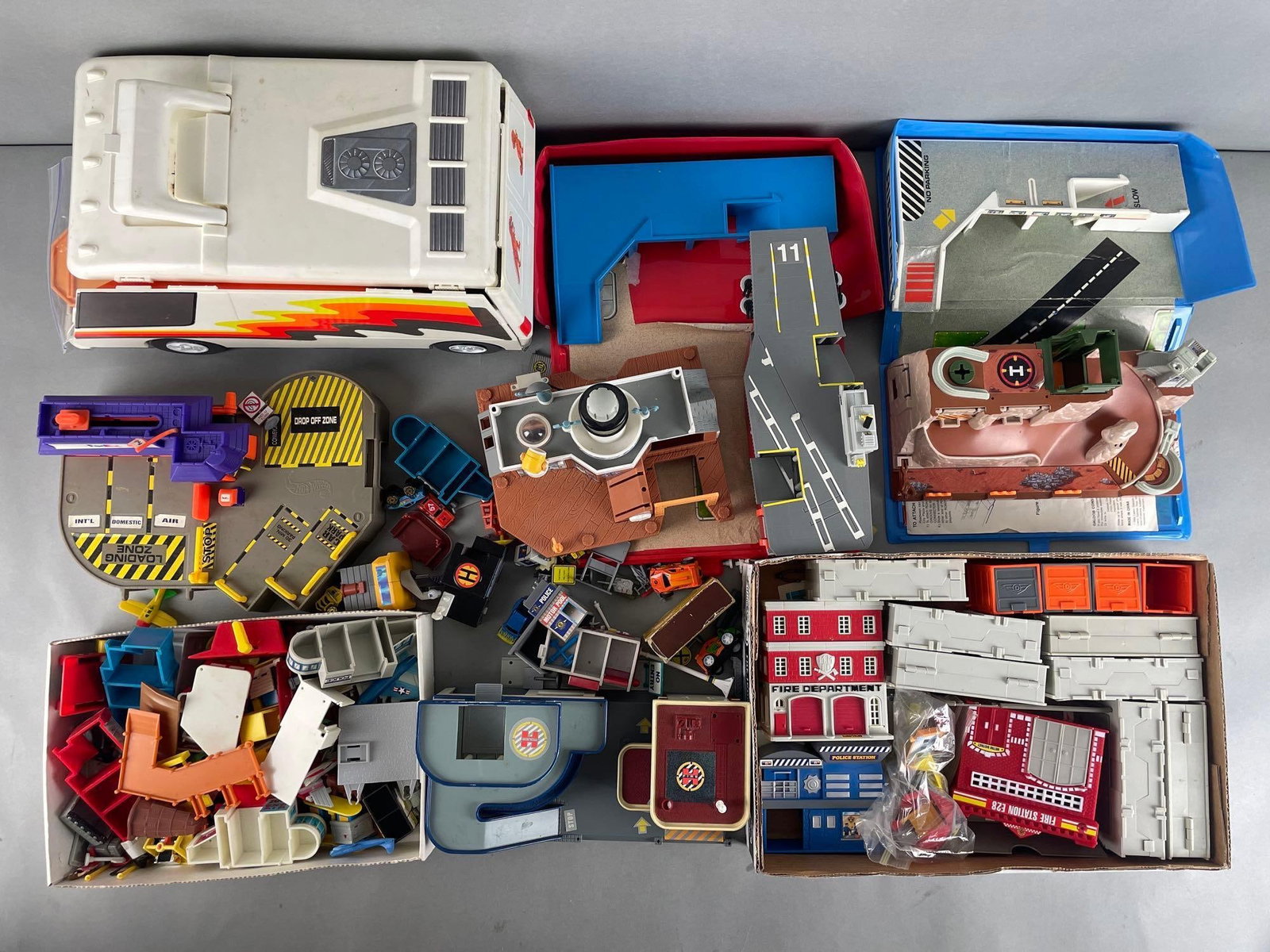 Group of Micro Machines Playsets and More: Includes police and fire station, harbor patrol, vehicles, and more. Van measures 7 x 15 x 7 1/2 inches