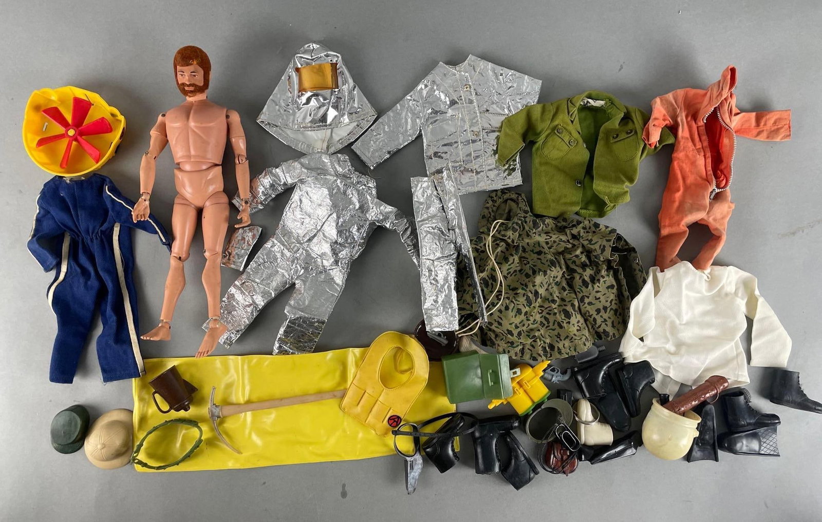 Group of Hasbro G.I. Joe Clothes and Accessories: Includes 1984 12 inch action figure, boots, heat suit, raft, and more