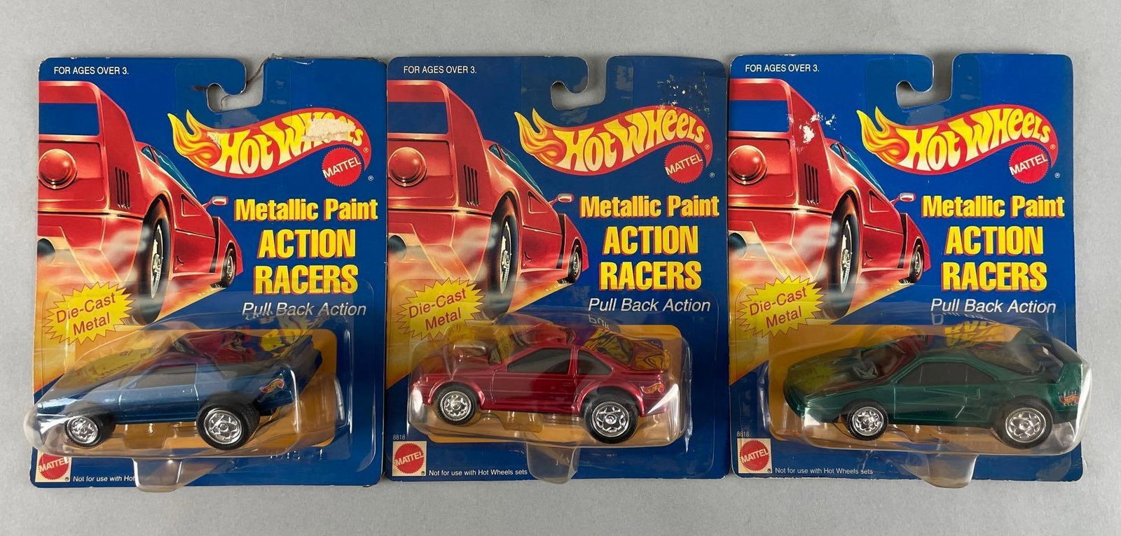 Group of Mattel Hot Wheels Metallic Paint Action Racers Die-Cast Vehicles: Approximately 1/43 scale, original packaging