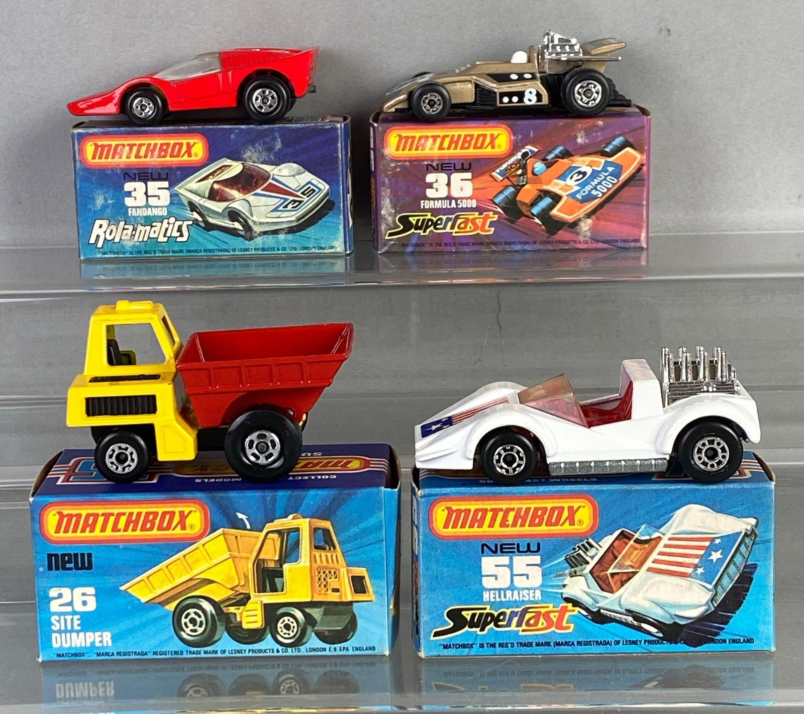 Group of 4 Matchbox Die-Cast Cars: Includes No. 26 Sit Dumper, No. 55 Hellraiser, No. 36 formula 500 and No. 35 Fandango, with boxes