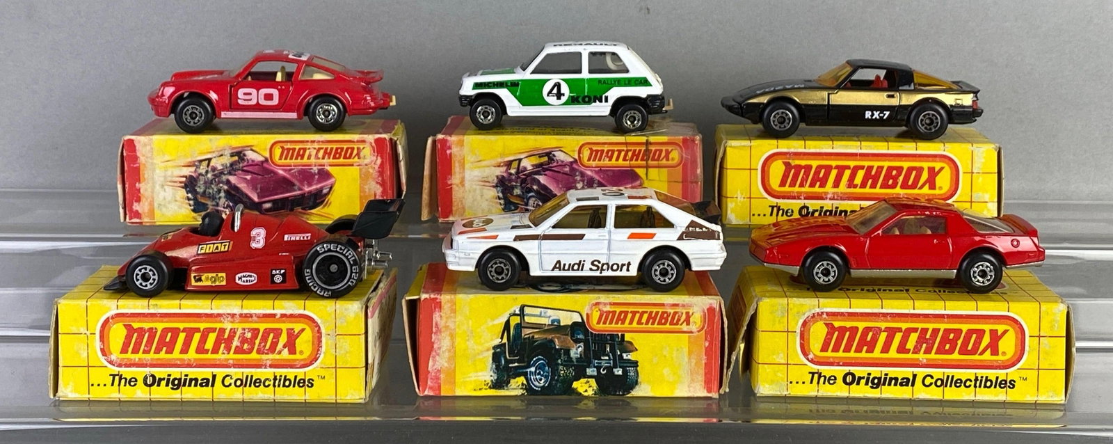 Group of 6 Matchbox Die-Cast Cars: Includes No. 3 Porche, No. 16 formula Racer and more, some boxes non original, some tears shown