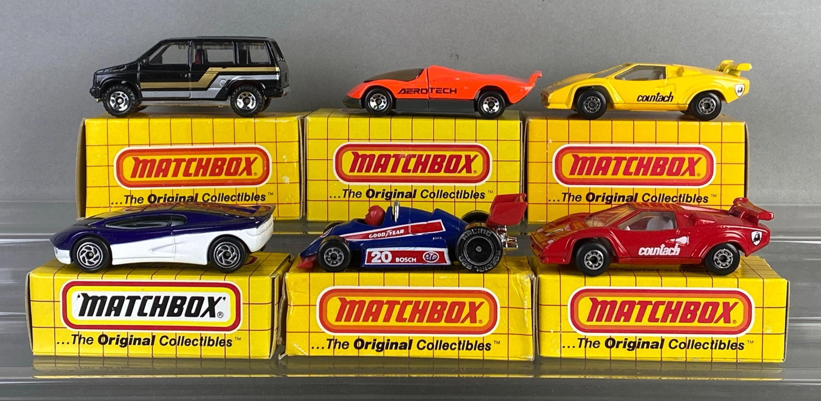 Group of 6 Matchbox Die-Cast Cars: Includes No. 62 Oldsmobile aero tech, Lamborghini Countach, No. 63 Formula racer and more, with boxes
