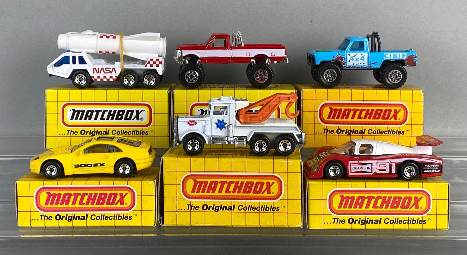 Group of 6 Matchbox Die-Cast Cars: Includes No. 65 f150 pickup, No. 66 Group c racer, No. 57 mountain man and more, with boxes