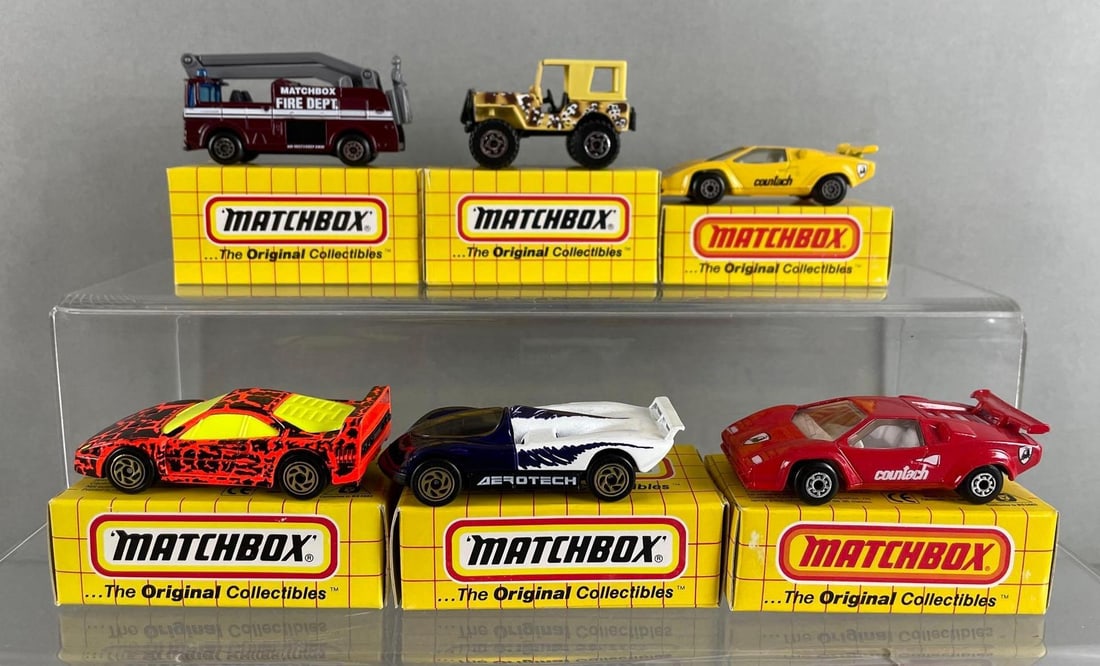 Group of 6 Matchbox Die-Cast Vehicles: Includes Lamborghini countach, Ferrari f-40, Oldsmobile aerotech, and more, with boxes