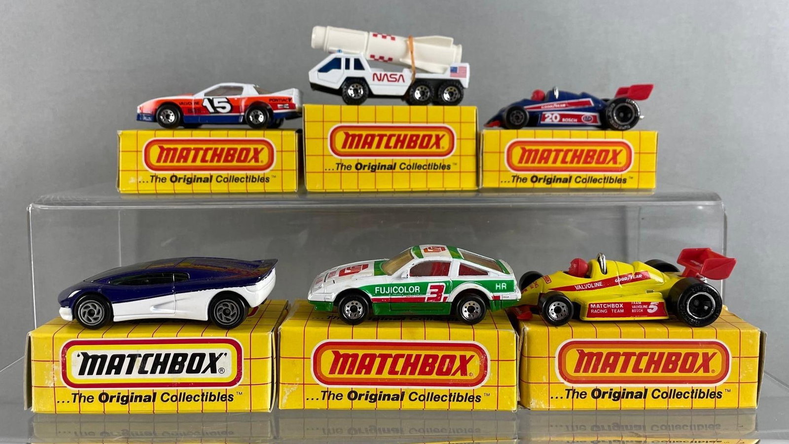 Group of 6 Matchbox Die-Cast Vehicles: Includes formula racer, Indy racer, street streak, and more, with boxes