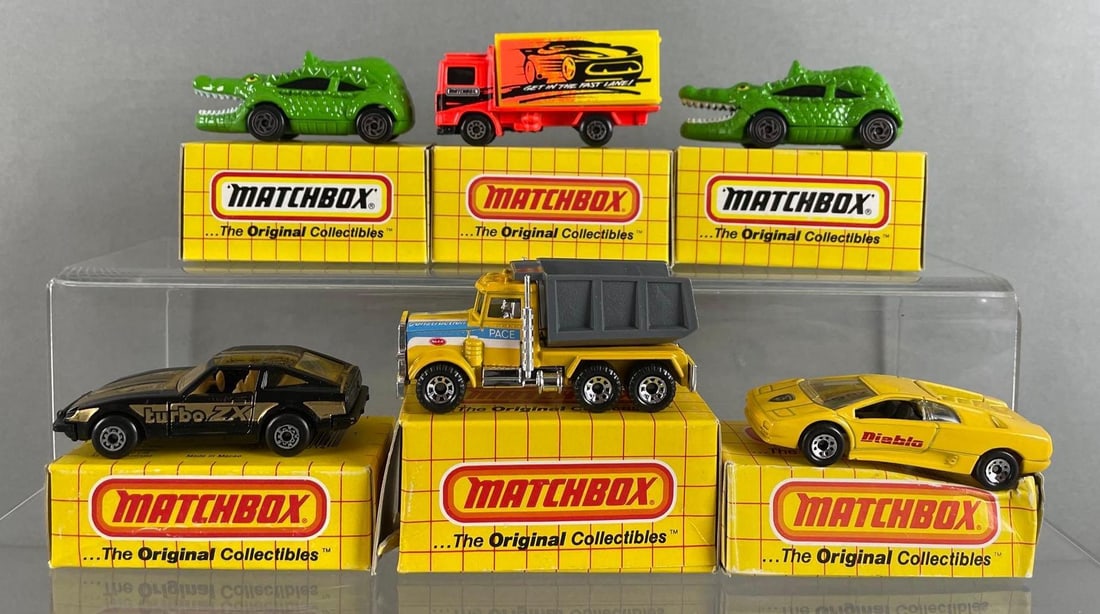 Group of 6 Matchbox Die-Cast Vehicles: Includes tailgator, Lamborghini Diablo, Volvo container truck, and more, with boxes