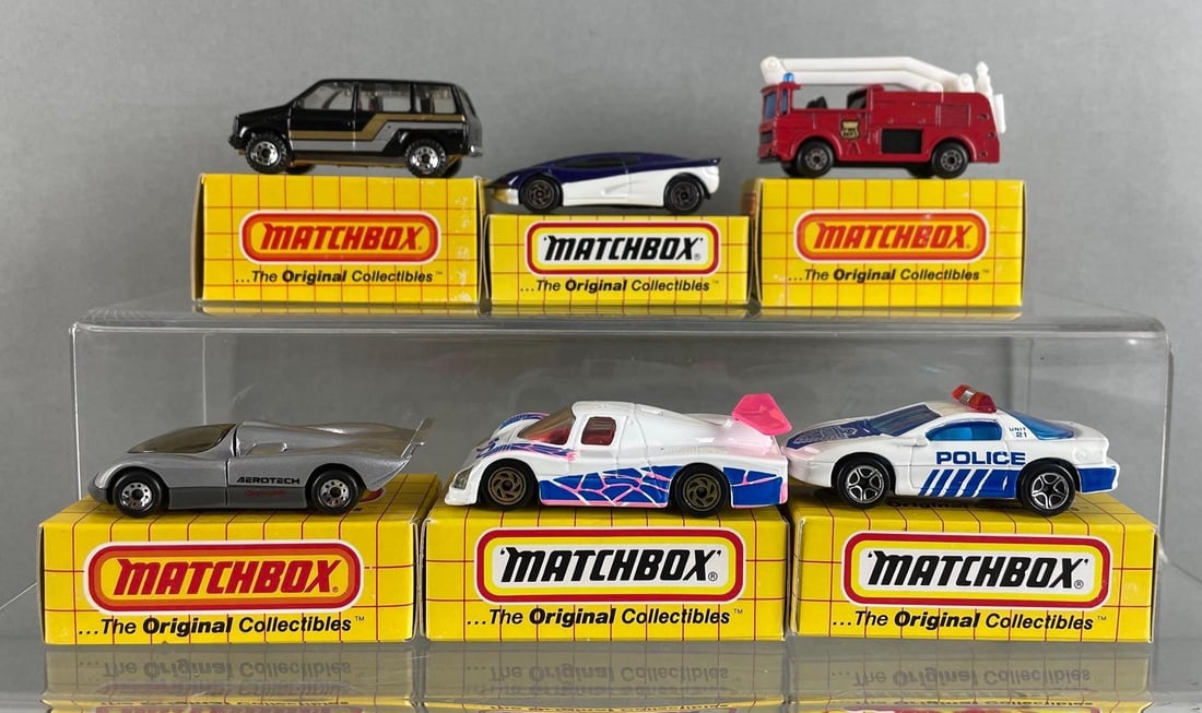 Group of 6 Matchbox Die-Cast Vehicles: Includes Oldsmobile aerotech, sauber group c racer, street streak, and more. With Boxes