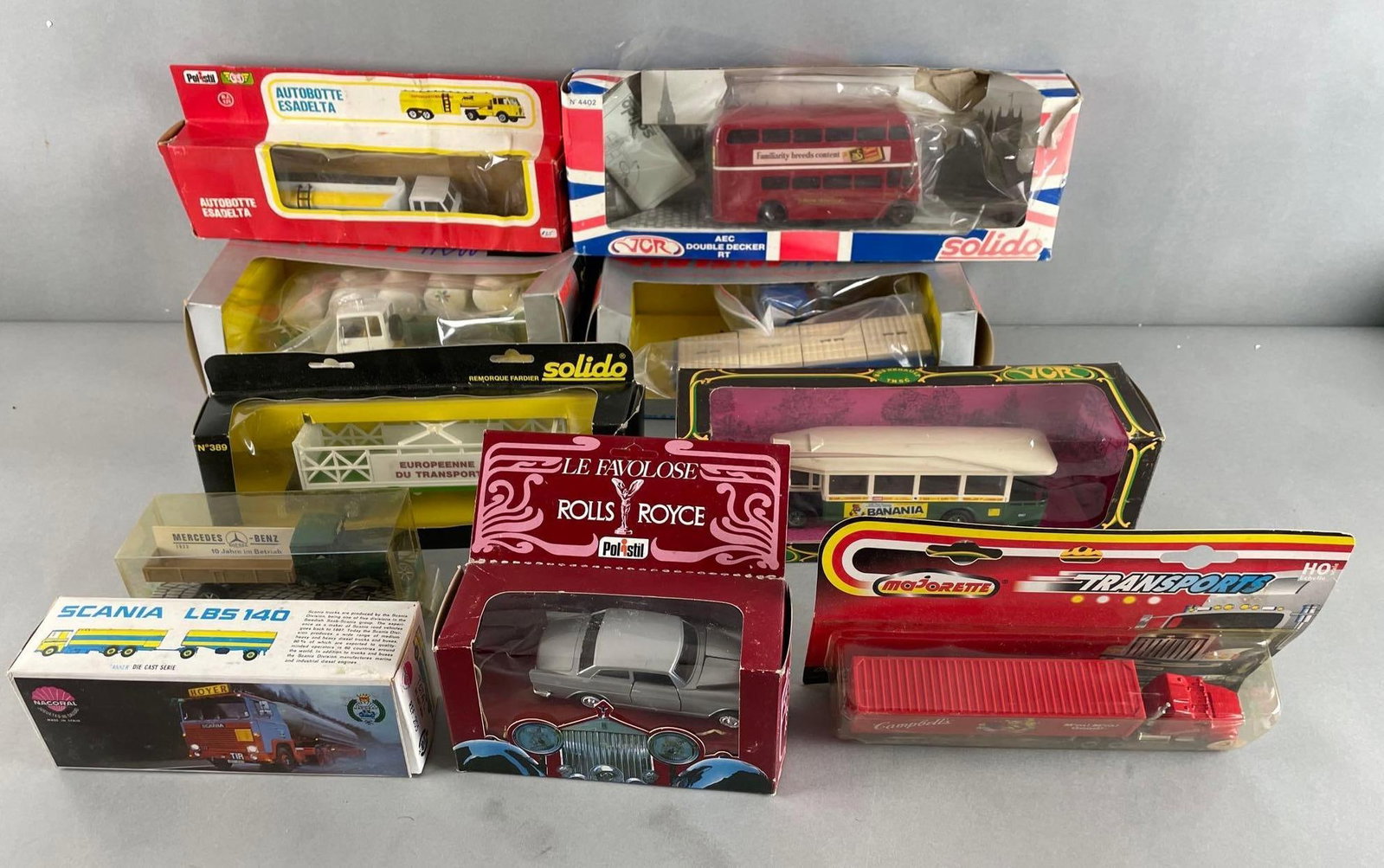 Group of Foreign Die-Cast Vehicles: Includes damaged original packaging measures, Solido, Mercedes Benz, tractor trailers