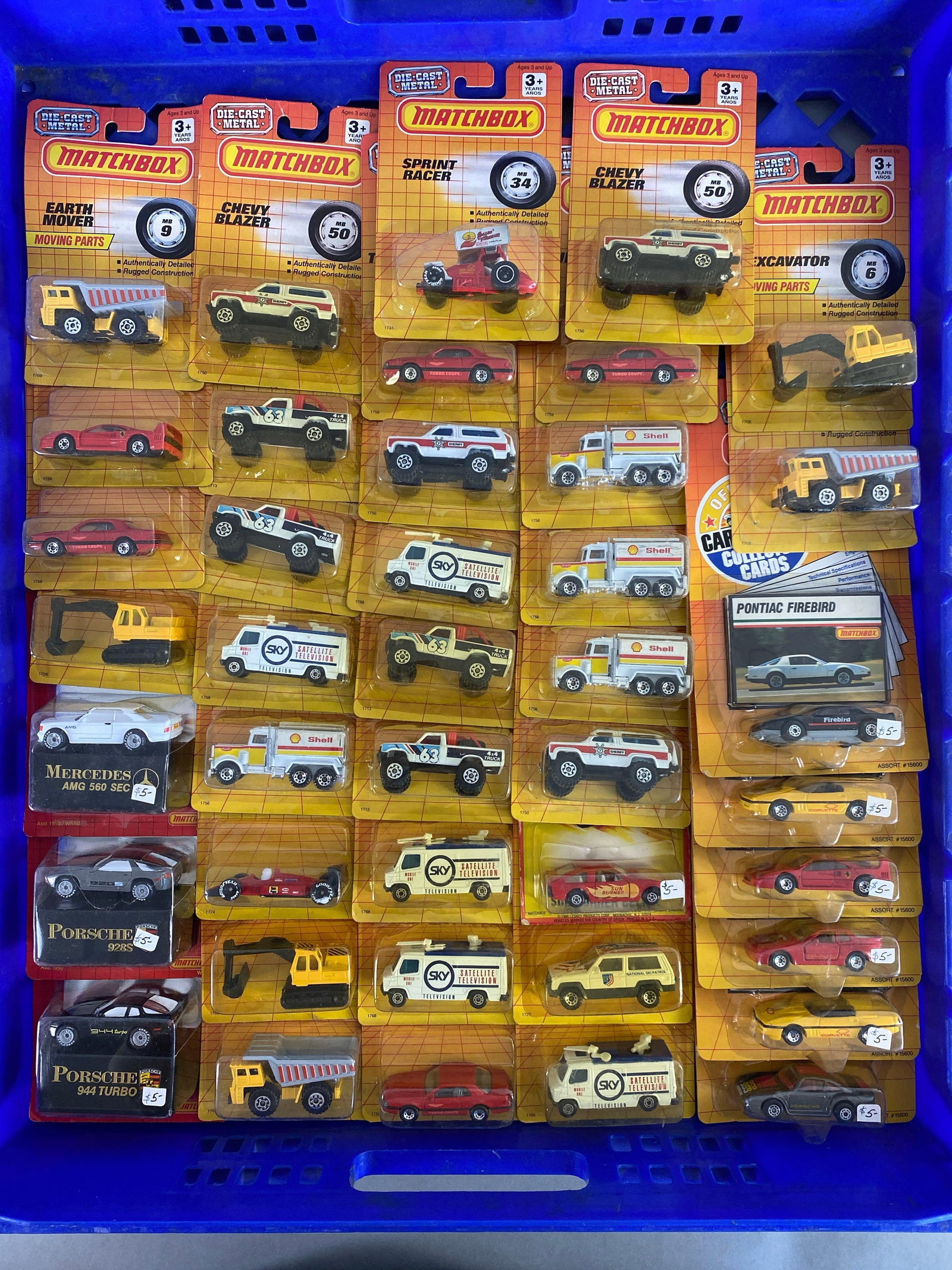 Group of 41 Matchbox Die-Cast Vehicles: like new in packaging, includes Mercedes AMG 560 Sec, Earth mover, Chevy blazer and more